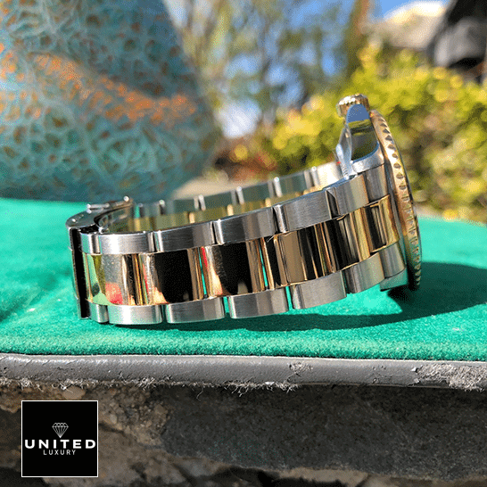 Rolex Submariner 16613 "Serti Two-Tone" Top Grade Clone 1:1 rolex submariner 16613 replica bracelet Rolex Submariner 16613 Serti Two Tone Stainless Steel Gold Diamond Replica on the table