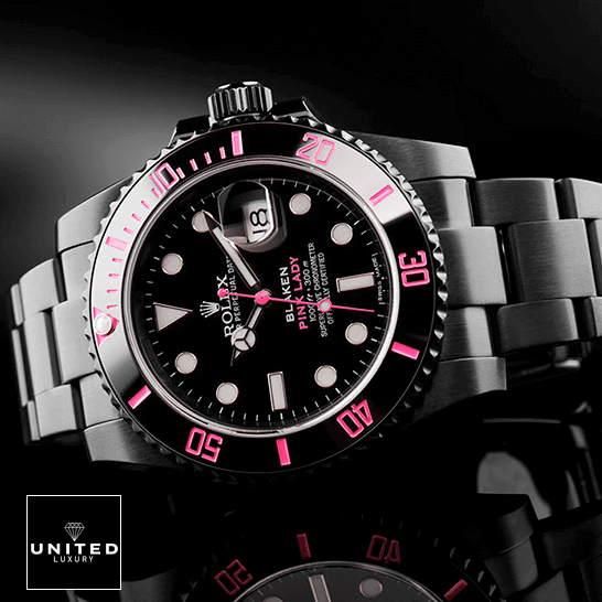 Rolex Submariner 116610N "Pink Venom" Perfect Duplicate 1:1 Rolex Blaken Submariner Pink Bezel and Black Dial on the table