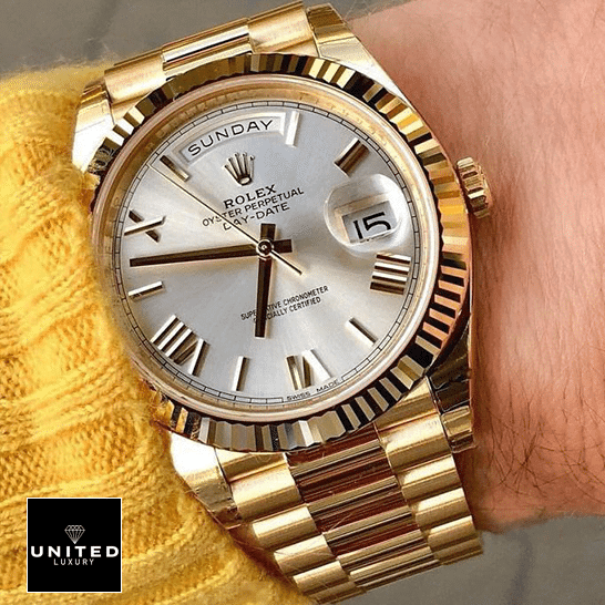 Rolex Day-Date 228238-0042 "Gold Roman Dial" Ultimate Clone Quality rolex day date 228238 0042 replica hand Rolex Day-Date 40 228238 Replica on his arm