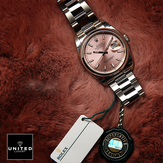 Rolex Datejust 116200-0079 Exclusive Clone Edition rolex datejust 116200 Steel automatic champagne silver replica unitedluxurynet 1 Rolex Datejust 116200 Pink Dial Replica next to the quarantine card on soft ground