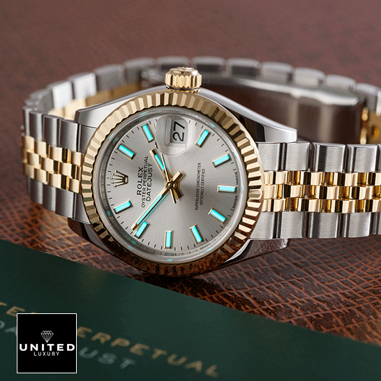 Rolex Datejust 126333-0002 Super Clone Edition rolex datejust 126333 yellow gold steel silver dial jubilee left Rolex Datejust 126333 Jubilee Yellow Gold Replica next to warranty card