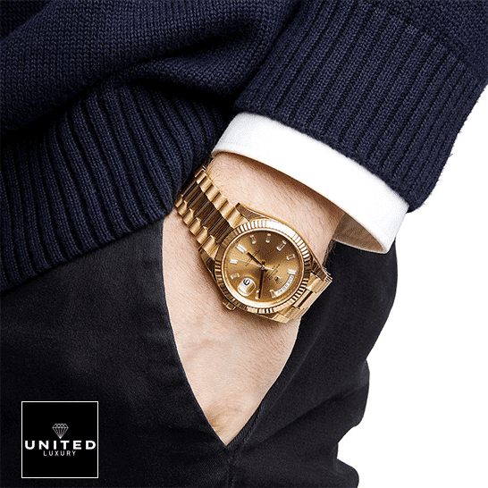 Rolex Day-Date 228238 "Champagne Dial" 1:1 Clone Edition rolex day date 228238 eW yellow gold champagne the gold Rolex Day Date watch on the man's arm