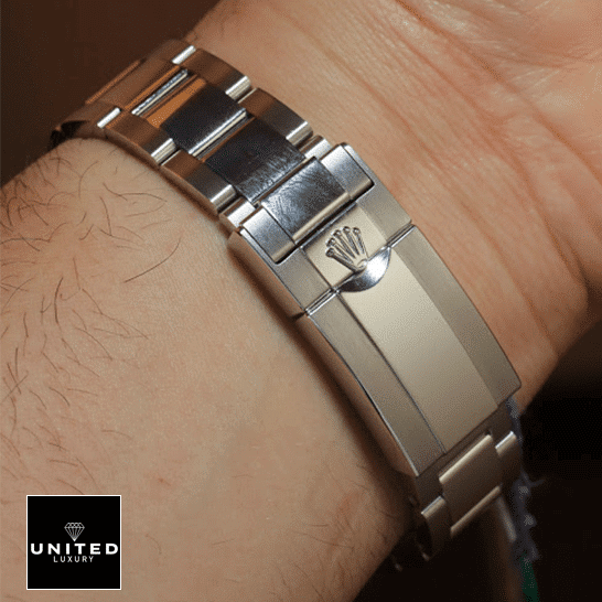 Rolex Daytona Cosmograph 126506 "Platinum" Exceptional Replica 1:1 Rolex Daytona 116506 S.Steel Oyster Bracelet Fold Clasp on the Rolex Logo Replica on his arm