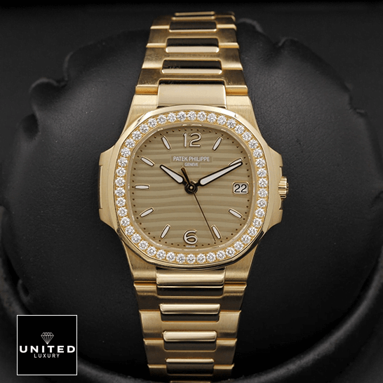 Patek Philippe Nautilus 7010/1R "Golden Dial" Collector’s Copy 1:1 patek philippe nautilus 70101R 012 replica front Patek Philippe Nautilus 70101R-012 Diamond Bezel Gold Bracelet Replica black background