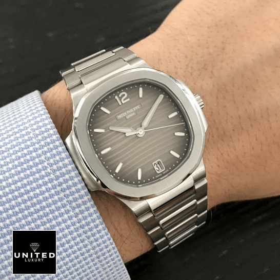 Patek Philippe Nautilus 7118/1A "Smoke Gray Dial" Premium Clone Edition patek philippe nautilus 71181A 011 hand right Patek Philippe Nautilus 71181A-011 Grey Dial Stainless Stell Replica on the man wrist