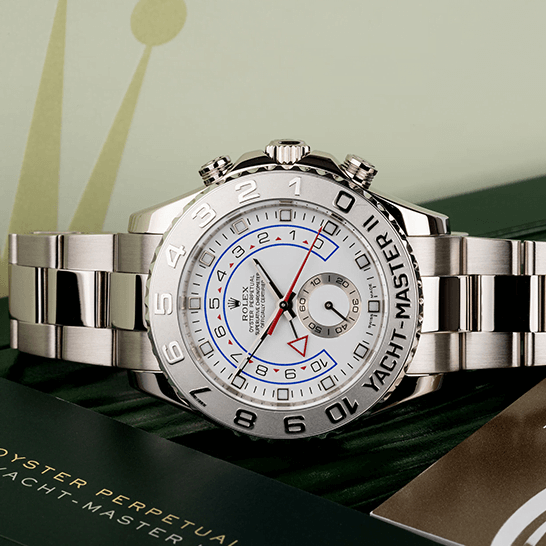 Rolex Yacht-Master II 116689 White Gold 1:1 Master Replica rolex yacht master 116689 0001 replica tiltedleft Rolex Yatch Master 116689-0001 White Dial Replica next to warranty card