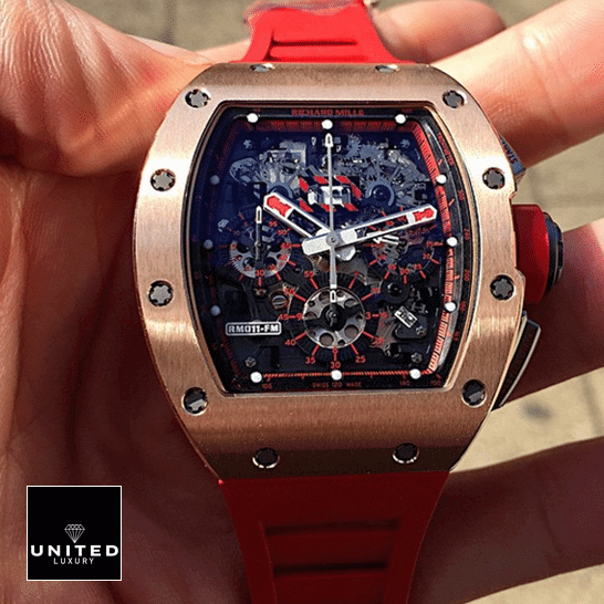 Richard Mille RM011 Red Bracelet Gold Bezel Black Dial Replica on the hand