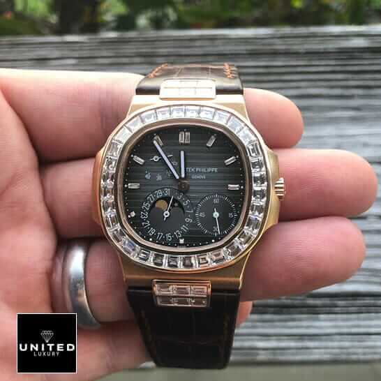 Patek Philippe Nautilus 5724 "Baguette Diamonds" 1:1 Clone Edition patek philippe baguette replica 2 Patek Philippe Black Dial Brown Leather Bracelet Replica on the man hand
