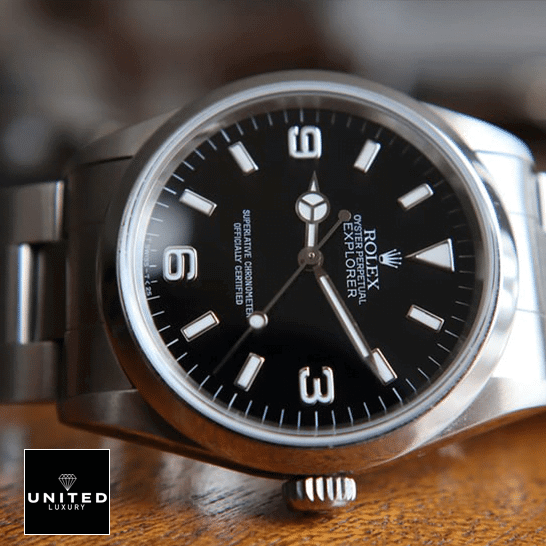 Rolex Explorer 124270 "Black Dial" Pro Clone 1:1 Rolex Explorer 124270 Stainless Steel Case and Bezel Replica on a wooden table