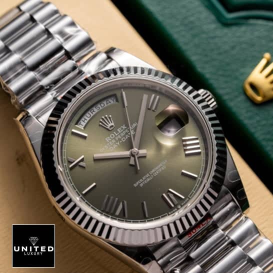 Rolex Day-date 228239-0033 Olive green dial replica above the rolex box