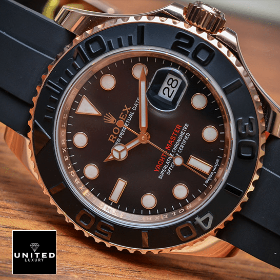 Rolex Yacht Master Black Dial Replica on the table