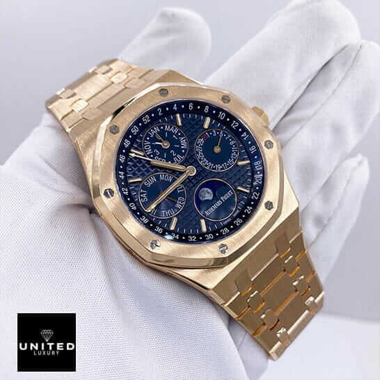 Audemars Piguet Gold Blue Dial Replica on the white glove hand