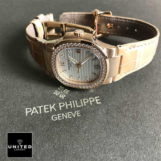 Patek Philippe 7010 Diamond Bezel Leather Bracelet Replica on the grey carpet