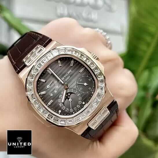 Patek Philippe Gold Case Diamond Bezel Black Dial Replica on thhe hand