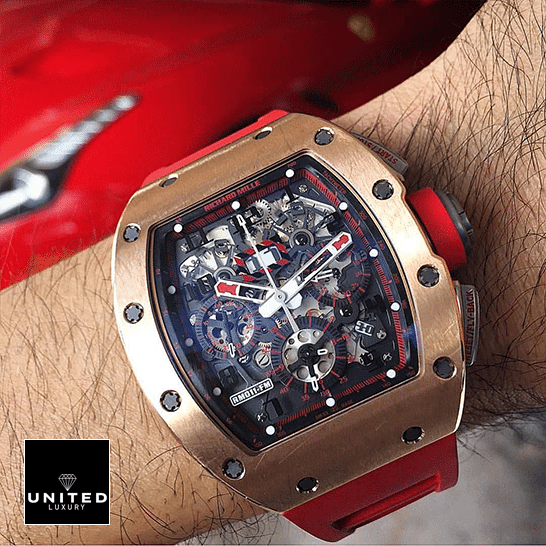 Richard Mille RM011 Red Demon Black Dial Gold Bezel Replica on the man wrist