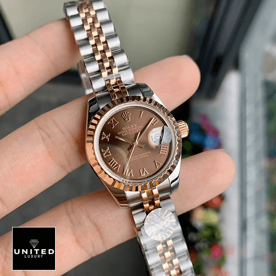 Rolex Datejust 288271 Everose Gold Roman Dial Replica on the fingers