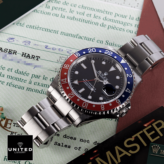 Rolex GMT-Master Pepsi 116719BLRO-0001 Replica on the table