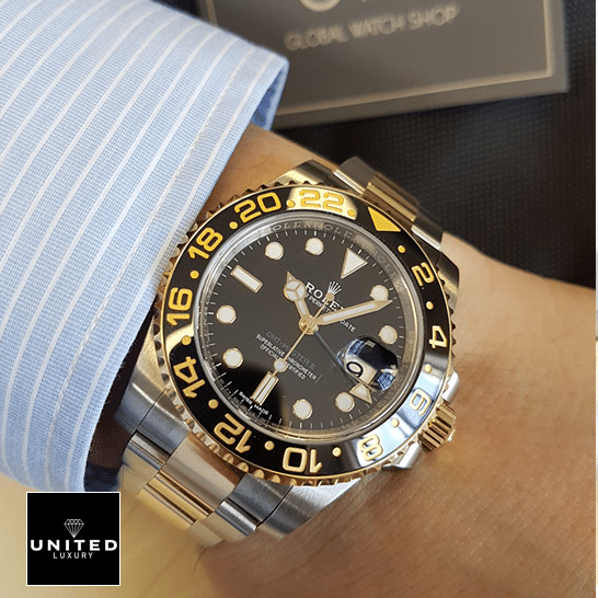 under the shirt Rolex GMT-Master II 116713 Two Tone Oyster Replica on his arm
