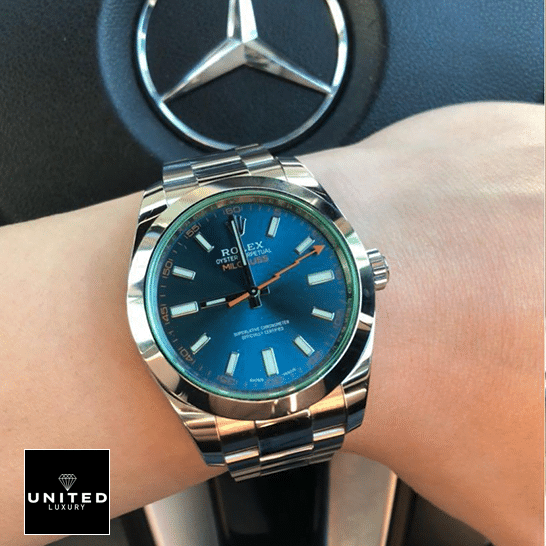 Rolex Milgauss 116400GV Green Crystal Oyster Replica on his arm and Mercedes logo on the back